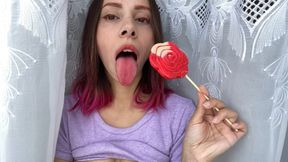 Naughty stepsister sucks a lollipop and shows her long hot sexy tongue