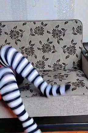 Gorgeous Femboy Posing with Flowers in Sunny Garden