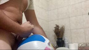 In the bathroom with a beach ball