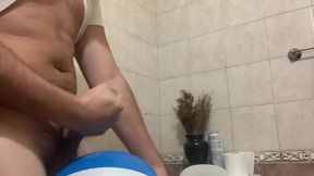 In the bathroom with a beach ball