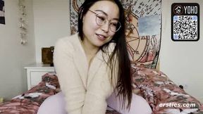 Asian brown-haired with glasses plays with dildo