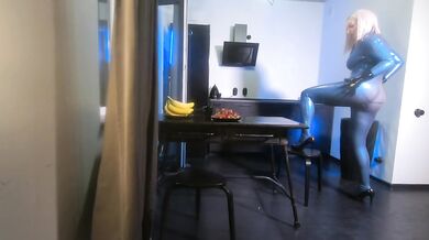 Latex rubber fetish curvy milf woman in blue texturized catsuit. Backstage from the photoshoot.