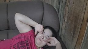 The girl on the sofa starts to yawn