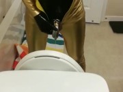 Peeing through chastity in catsuits