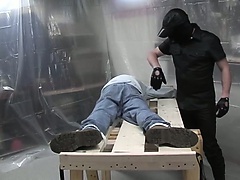 Dude in jeans gets tied down and has his ass dominated by a gimp