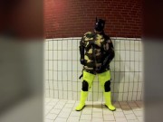 Pawing off in camo painter's overall and hi-viz waders