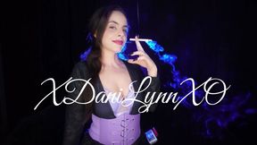 Smoking Wearing Purple Bra and Corset