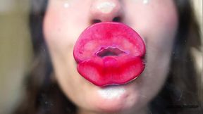 Wet red sticky lipgloss kiss