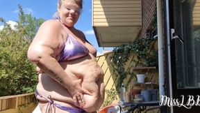 Greasy SSBBW Goddess Oils Her Belly and Body Outdoors