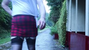 Crossdressed outdoors on a station platform