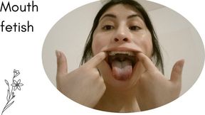 inspect my huge mouth in front of the camera for you..