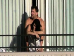 a coach fucks his girl out the balcon