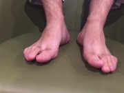 Manlyfoot - The green chair - Aussie guys size 11 1/2 feet on display in work trip hotel room