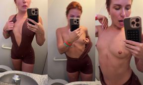 Redhead teases and flashes skin in the tight airplane bathroom stall
