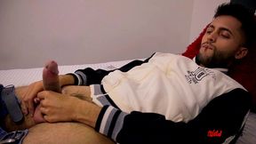 camilo jerking off inside a condom, filling it with cum, and then eating his cum from it.