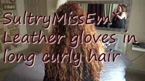 Leather gloves in long curly hair