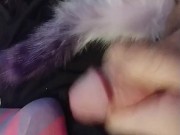 Horny slut in knee highs with a plug tail cums closeup