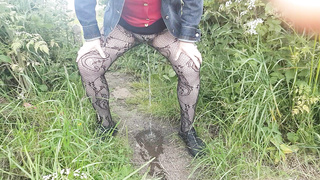 Peeing in field in tights