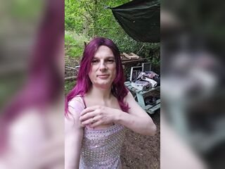 Putting my pretty costume on over my luxury underware in the woods