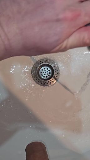 Pissing to the Bathroom Sink