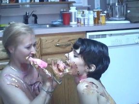 Older and younger lesbians rub food all over each other on the floor