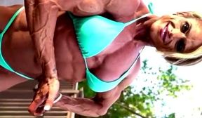 blonde female bodybuilder flexing