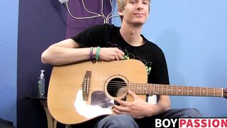 Young man plays guitar before dick stroking and cumming