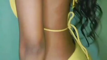 Young Indian student girl plays with vibrator