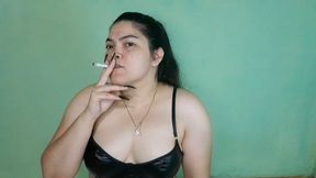 An exotic, sensual girl starts smoking after a long time.