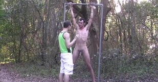 Skinny boy gets tied up to a tree and seduced in bondage perversions