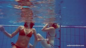 Blonde And Brunette Babes Swim