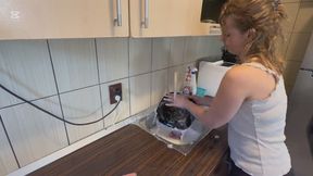 hair wash with dishwasher liquid in kitchen sink
