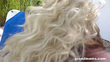 Busty mature blonde gets fucked by the pool