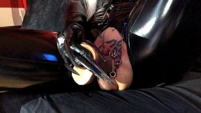 Sexy latex girl with extreme long nails shows her pierced and tattooed pussy