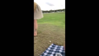 Extremely public pee on sports field (people on the street)