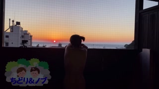 An amateur Japanese woman taking a leisurely bath at a hot spring inn with an open-air bath.