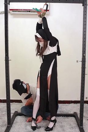 The Girlfriend Role-plays a Nun, Handcuffed and Shackled, Bound to an Iron Frame