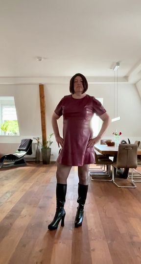 Nicolette in a sexy leather dress and platform high-heel boots