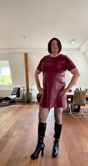 Nicolette in a sexy leather dress and platform high-heel boots
