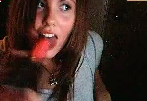 Young and sexy runette bitch with nice face licks the dildo