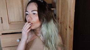 Modest stepsister smokes a cigarette