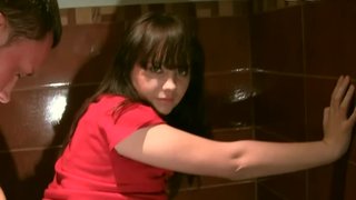 A sexy woman is in the public restroom, making a sex tape video