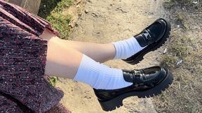 Shoeplay in the park on a sunny afternoon wearing loafers and white socks