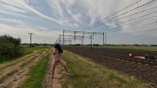 She massages her pussy all naked in public, even the train slowed down to watch...