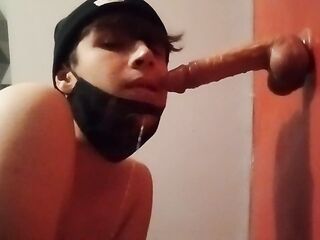 Chained femboy suck a sextoy with a chastity cage