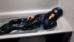 gasmask and wetsuit in bathtub cum