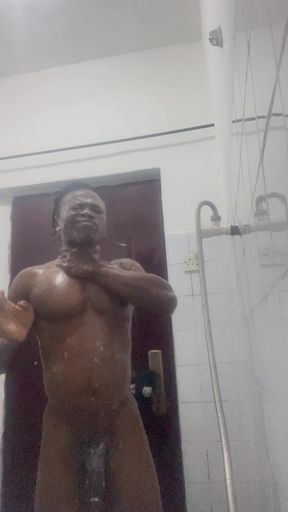 Watch how I take my bath and stroke my black cock