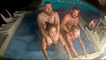 Busty blonde milf and her friend go wild in a hot tub foursome