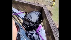 BDSM slavegirl in leather hood is tied up outside for public deepthroat session