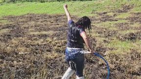 Outdoor hose wetlook wearing navy polo shirt and jeans